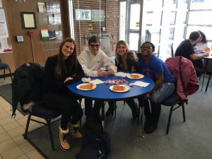 On Campus students pose at a lunch table