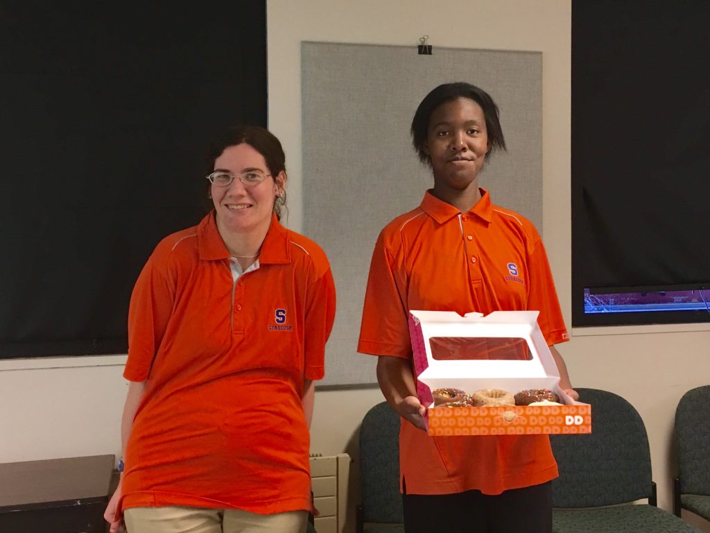 Two project search students in their intern uniforms